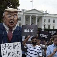 People gather outside the White House on Pennsylvania Avenue in Washington, Tuesday, July 11