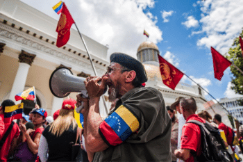 | A man yells anti imperialist chants around the Legislative Palace while waiting for Constituent Assemblys installation | MR Online