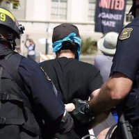 Activist being handcuffed in Berkley antifa protests