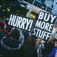 | Hurry Buy More Stuff sign at protest | MR Online