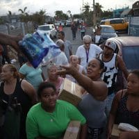 Hurricane Maria survivors receive food and water .