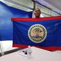 | Garfield Murrillo of the Belize Venezuela Solidarity Committee holds the Belizean flag during Sundays with Maduro Jeanette CharlesVenezuelanalysis | MR Online