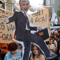 FACT NOT FAKE: Demonstrators protest against pension reforms proposed by the government and holding an cutout of President Michel Temer, 10 days ago