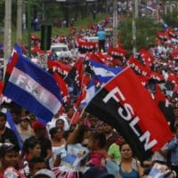  | Sandinistas and followers of President Daniel Ortega wave their Sandinista flags in a march for peace in Managua Nicaragua Saturday | MR Online