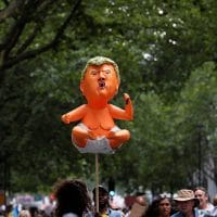 Demonstrators hold a handmade model depicting a 'baby Donald Trump' as they take part in an anti-Trump protest in central London