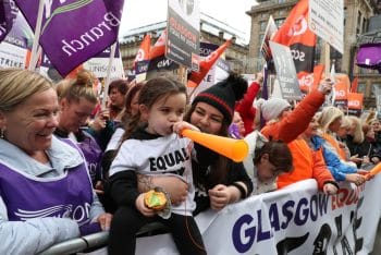 Young girl at strike (Photo Credit - Morning Star Online)