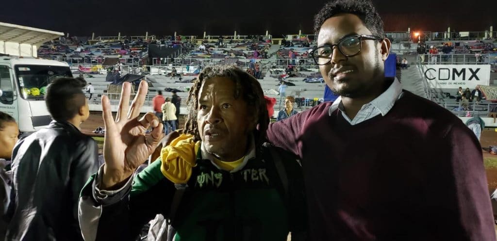 | Tadios Belay meets with migrants from the caravan to assess their legal medical basic needs at the Jesus Martinez stadium in Mexico City Twitter | tadiosassefa | MR Online