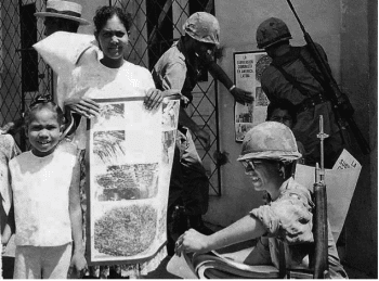  1st U.S. PSYWAR (Psychological War) battalion hands out anti-communist posters in Santo Domingo (Dominican Republic), 1965.