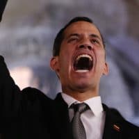 Accompanied by his wife Fabiana Rosales, Venezuela’s self-proclaimed interim president Juan Guaido waves to supporters outside the Foreign Ministry in Buenos Aires, Argentina, March 1, 2019. Guaido is in tour of several South American capitals as part of a campaign to build international pressure on Venezuela’s president, Nicolas Maduro. Natacha Pisarenko | AP