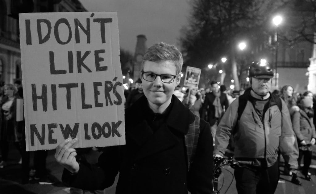 | Protesters sign I dont like Hitlers new look | MR Online