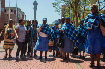 Residents from Lesetlheng village in South Africa’s North West Province celebrating outside the Constitutional Court after it set aside the High Court interdict evicting them from their farm land. Ihsaan Haffejee, 2018.