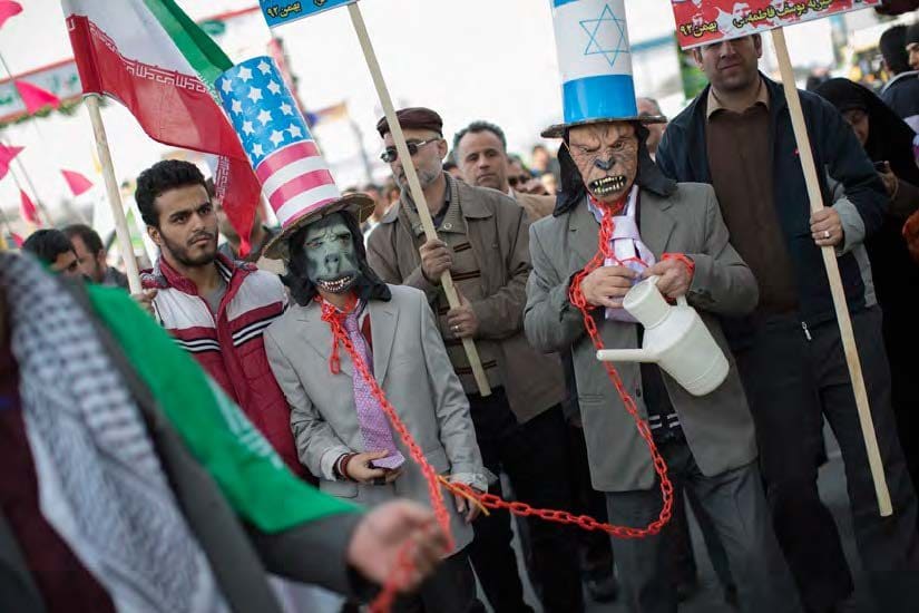 | Iranian protestors wear masks as well as hats with the US flag and Israeli flags | MR Online