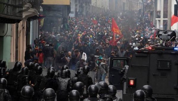 | Demonstrators clash with riot police during protests after Ecuadors President Lenin Morenos government ended four decade old fuel subsidies in Quito | Photo Reuters | MR Online