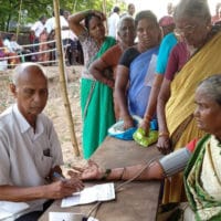 A volunteer taking a blood pressure test before a doctor’s consultation at a CPI(M)-run camp in Wyra, Khammam District, Telangana. Tricontinental: Institute for Social Research