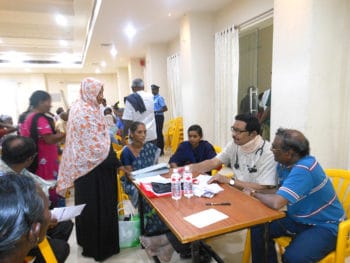 Dr. D. Rajeshwar Rao, Superintendent of the Nellore People’s Polyclinic, and his colleagues prescribing medicines to patients at their medical camp in January 2020. K. Mastanaiah