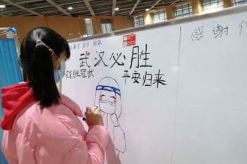 A 10-year-old patient draws on the notice board at a Wuhan hospital every day