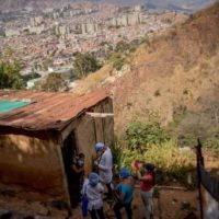 A doctor and members of the local health committee visit a family in Alto de Lidice, Caracas, Venezuela. Photo- Gsus Garcia