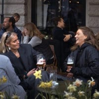 | People chat and drink in Stockholm Sweden Wednesday April 8 2020 © AP Photo Andres Kudacki | MR Online