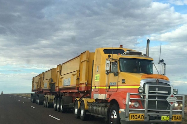 | Lone truck on road train travels down an empty highway | MR Online