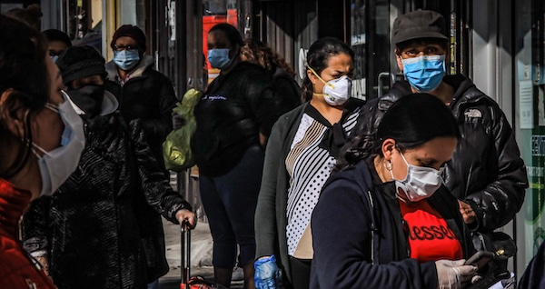 | Women in Brooklyns Sunset Park a neighborhood with one of the citys largest Mexican and Hispanic community wear masks to help stop the spread of coronavirus while waiting in line to enter a store May 5 2020 in New York Bebeto Matthews | AP | MR Online