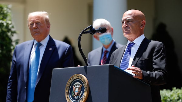 | President Donald Trump left listens as Moncef Slaoui a former GlaxoSmithKline executive speaks about the coronavirus in the Rose Garden of the White House Friday May 15 2020 in Washington AP PhotoAlex Brandon | MR Online