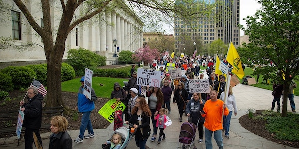 | Demonstrators protest outside the Ohio statehouse in opposition of Gov Mike DeWines stayathome order in Columbus Ohio on May 1 2020 Photo Anadolu AgencyGetty Images | MR Online