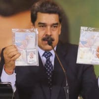 Constitutional President Nicolas Maduro shows the passports of the two U.S. Silvercorp mercenaries captured in Venezuela after the failed raid on Macuto. Photo: AFP