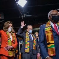 House Speaker Nancy Pelosi of Calif., House Majority Whip James Clyburn of S.C., and top Congressional Democrats raise their hands during a news conference to unveil policing reform and equal justice legislation on Capitol Hill, Monday, June 8, 2020, in Washington. (AP Photo/Manuel Balce Ceneta)