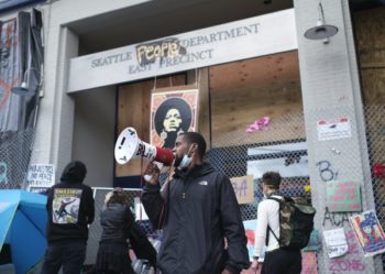 | An activist outside the abandoned police station in Seattles Capitol Hill neighbourhood Stephen BrashearEPA | MR Online