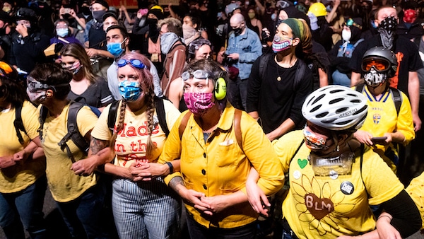 | Black Lives Matter protesters gather outside the Mark O Hatfield United States Courthouse on Sunday July 19 2020 in Portland Ore Officers used teargas and projectiles to move the crowd after some protesters tore down a fence fronting the courthouse AP PhotoNoah Berger | MR Online