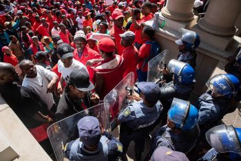 Madelene Cronjé New Frame South Africa Police barricade the entrance to the City Hall during a march of thousands of members of Abahlali baseMjondolo protesting against political repression Durban 8 October 2018