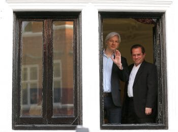 Assange, left, with Ecuador’s Foreign Minister Ricardo Patino on the balcony of the Ecuadorian Embassy in London, June 16, 2013. Frank Augstein | AP