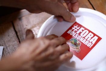 | During the sixth Marmita Solidária Solidarity Prepared Meals in Rio de Janeiro 300 meals were prepared with food produced by family farms in settlements organised by the MST In addition to solidarity the meals carry political messages with them such as the Fora Bolsonaro Out Bolsonaro campaign Rio de Janeiro Brazil 24 August 2020 MSTRJ | MR Online