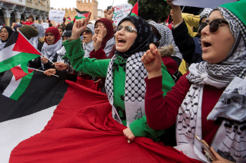 Pro Palestinian protesters wave Palestinian flags and chant slogans against the US and Israel in Rabat on 10 December 2017 AFP