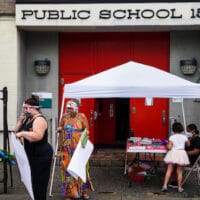 Teachers prepare an outdoor learning demonstration for students to display methods schools can use to continue on-site education during the coronavirus pandemic, Sept. 2, 2020, at P.S. 15 in the Red Hook neighborhood of the Brooklyn borough of New York. John Minchillo | AP
