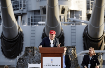 | Trump speaking before naval ship with cannons Source maritimeissuescom | MR Online
