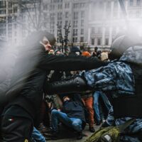 Supporters of detained Russian opposition leader Alexei Navalny clash with riot police officers during an unsanctioned rally in central Moscow on 01-23-2021