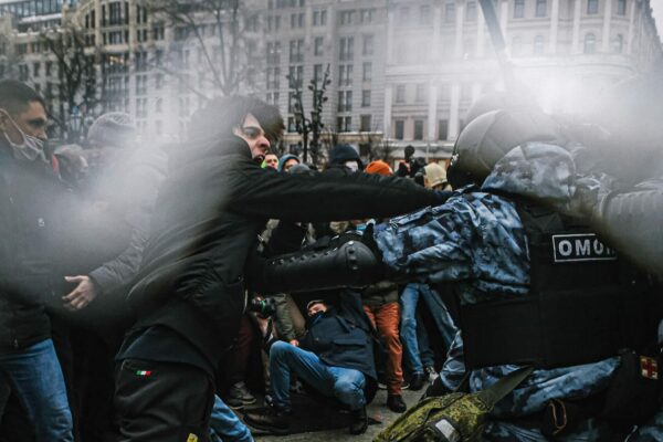 Supporters of detained Russian opposition leader Alexei Navalny clash with riot police officers during an unsanctioned rally in central Moscow on 01-23-2021