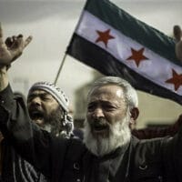 Syrians rally in front of the US Embassy to demand American military intervention and a no fly zone to stop the killings in Syria, in Amman, Jordan (Photo: Flickr - Freedom House)