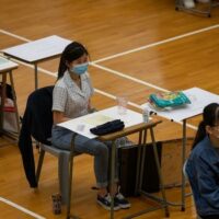 Students sit for the Diploma of Secondary Education (DSE) university entrance exams in Hong Kong on April 24, 2020