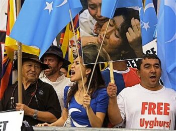 Uwyghur People Demand Freedom with Flag of East Turkestan in front of the UN Building in NYC