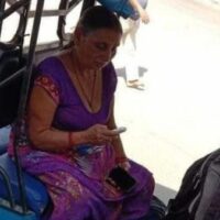 The viral picture that defines India’s Covid distress — an exhausted Chandrakala Singh, sitting stone-faced in an electric rickshaw with the body of her son Vineet Singh (cropped out) by her feet on a busy street in the city of Varanasi in the northern state of Uttar Pradesh, emblematic of the plight of Indians trapped between a raging pandemic and a healthcare system on the brink of collapse, April 22, 2021 (Photo by BBC)