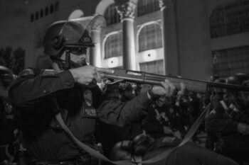 | Officer Andrey Nichik points his gun at protesters and journalists while yelling at them to clear the area Photo credit Jeremy Lindenfeld WhoWhatWhy | MR Online