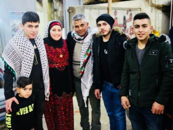 Iyad Burnat poses with his family circa 2019.