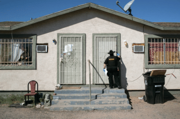 Maricopa County Constable Darlene Martinez knocks on a door before posting an eviction order on Oct 1 2020 in Phoenix Photo John MooreGetty Images