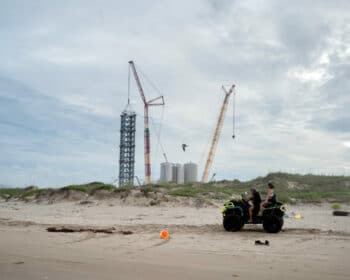 | TWO BEACHGOERS RIDE PAST THE SPACEX LAUNCH FACILITY AT BOCA CHICA BEACH PHOTO IVAN | MR Online