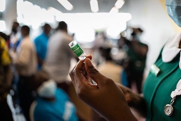 | COVAX rollout COVID19 vaccinations begin in Ghana nurse prepares vaccine | MR Online