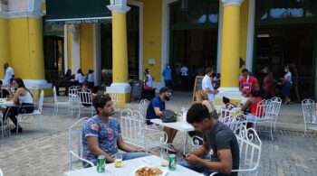 Life begins to return to normal at an outdoor cafe in Old Havana following a highly successful vaccination campaign, Oct. 10