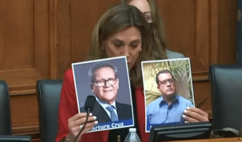 Far-right Florida Congresswoman María Elvira Salazar holding up photos of U.S.-funded coup leaders Felix Maradiaga and Arturo Cruz at a hearing on Nicaragua.