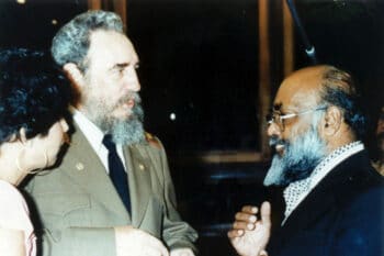 Circa 1980: Fidel Castro with Archie Singham.